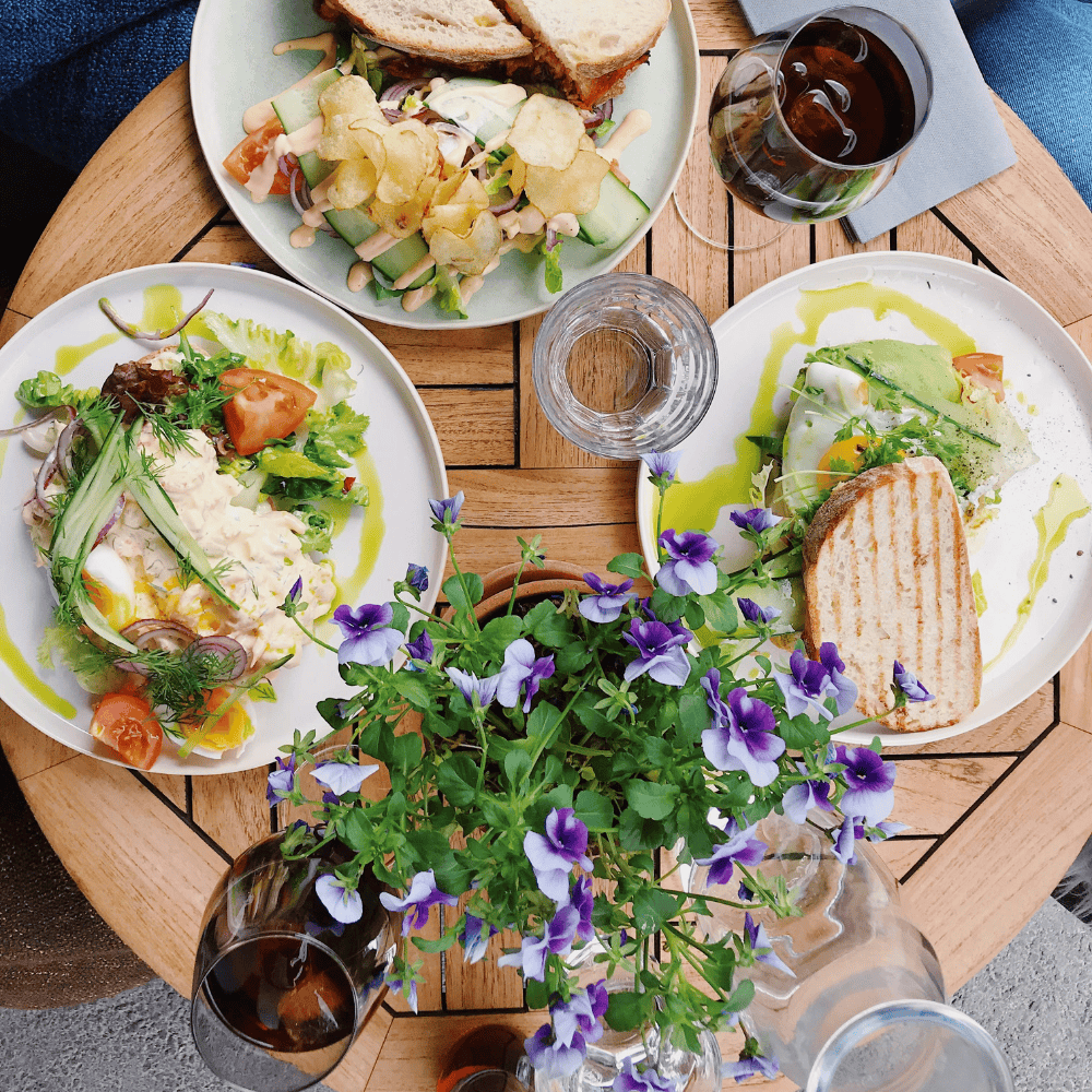 Elegant brunch table with fresh spring dishes and wine, capturing the essence of a thoughtful Mother's Day wine experience