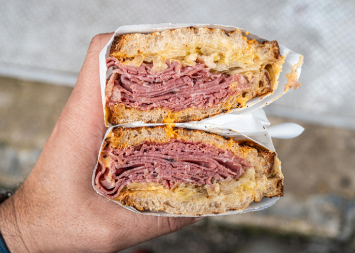 Classic pastrami on rye sandwich, an ideal NYC deli pairing for bold red wines and elevated wine and food pairings
